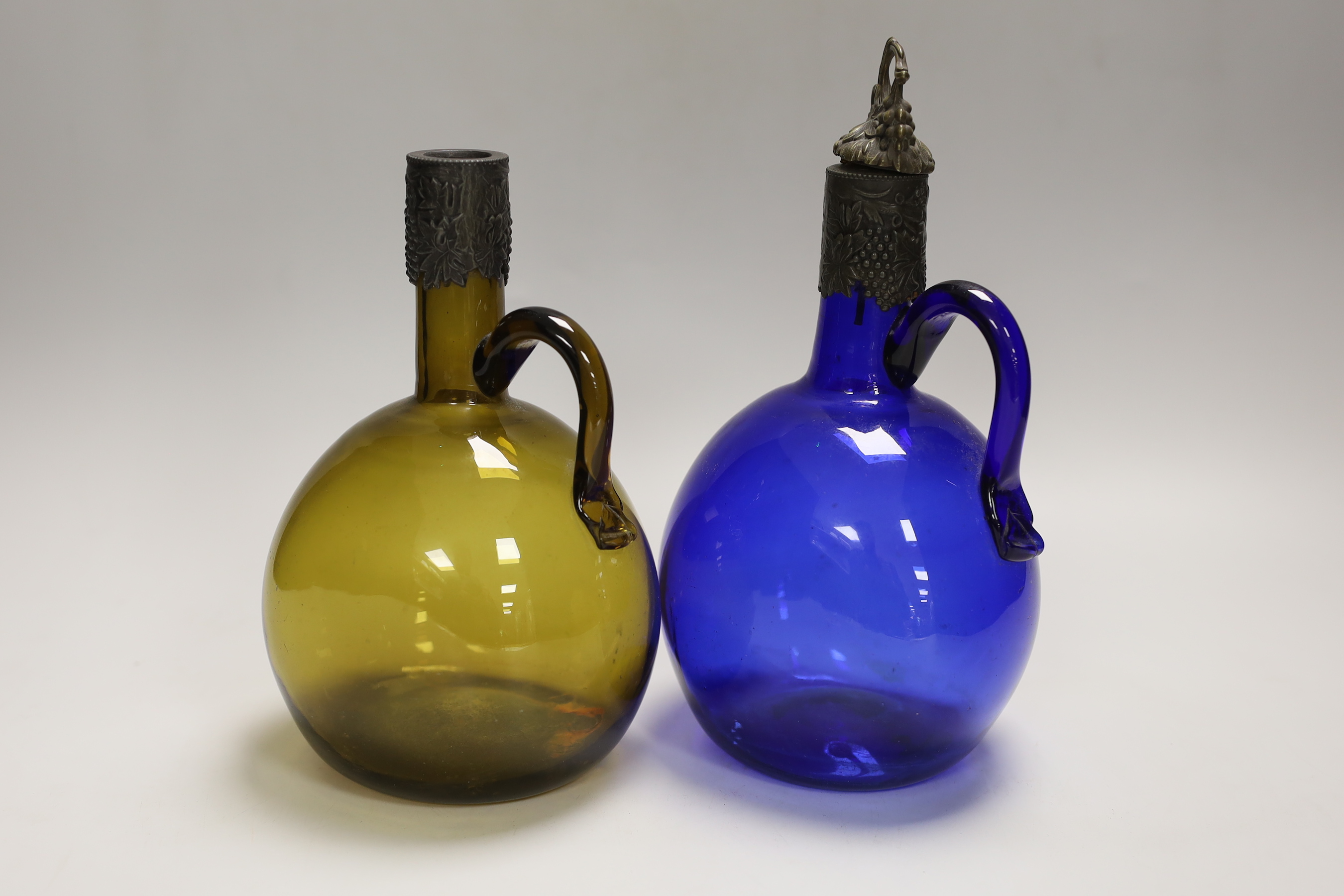 A pair of Victorian glass bottle decanters, tallest 23cm